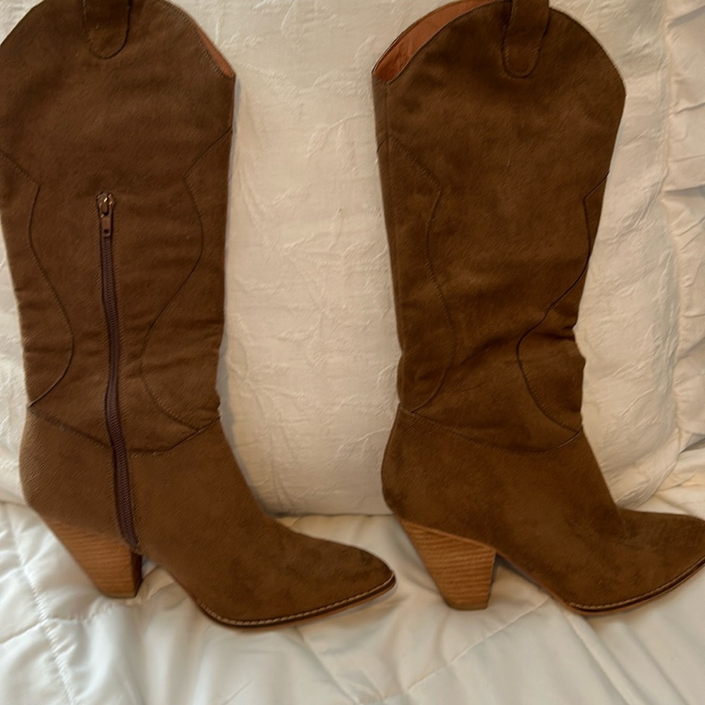 Nashville girl has too many boots!   Cute light brown cowboy boots.  7.5